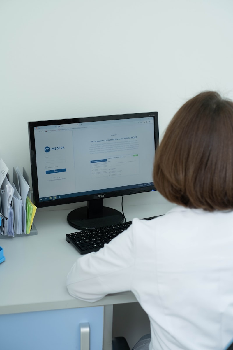 Healthcare worker at computer desk